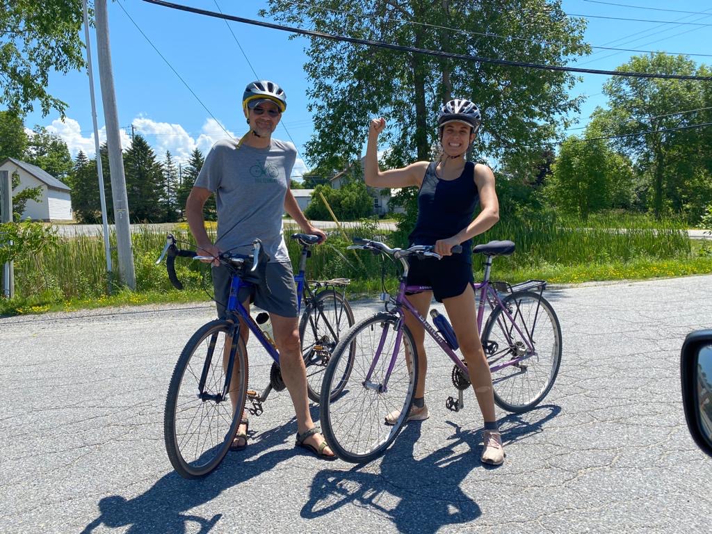 Two people riding a bike